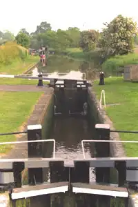Narrowboat approaching a canal lock